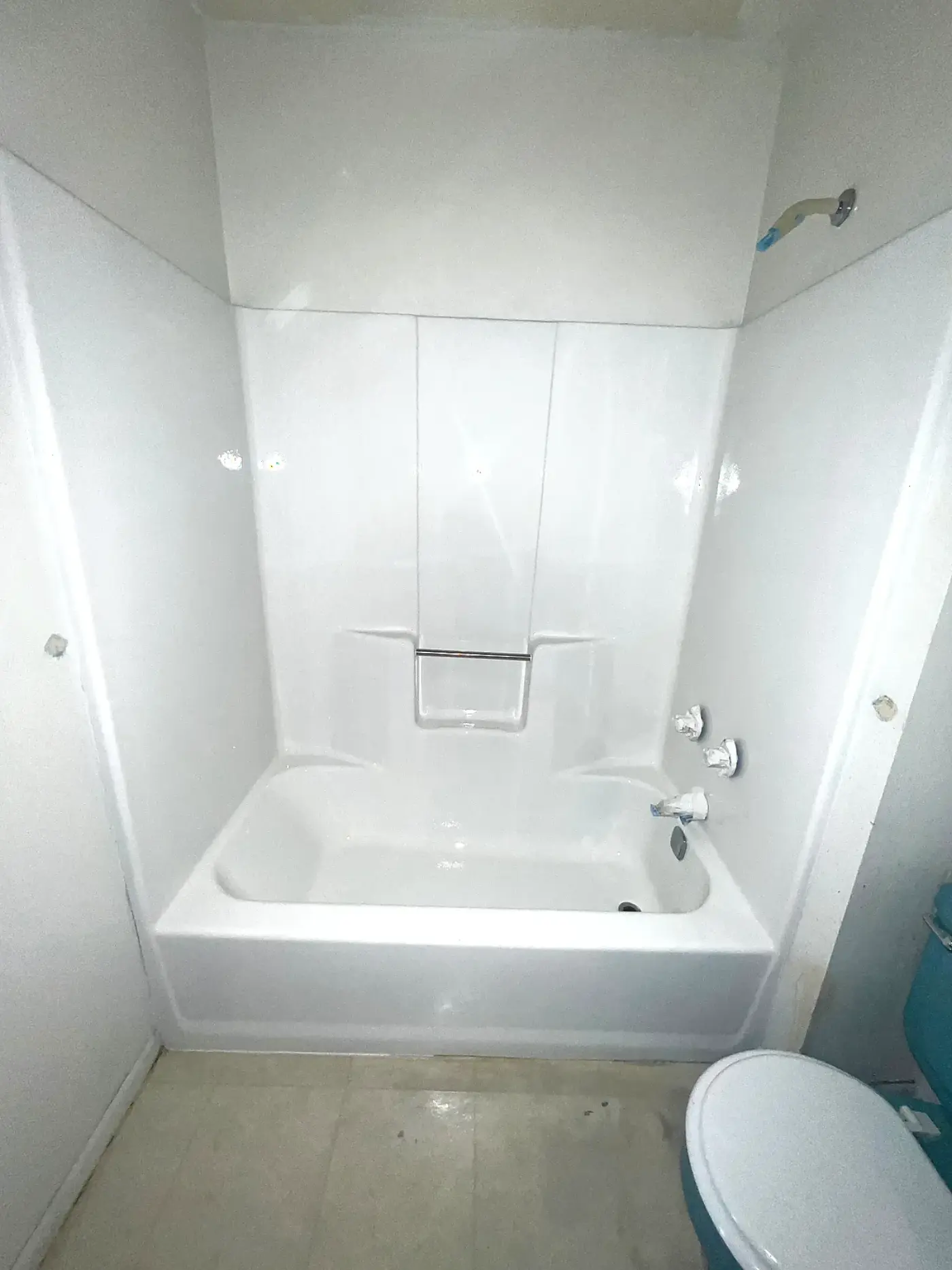 Same tub and shower surround after BathMasters refinishing on the Gulf Coast, bright glossy white finish